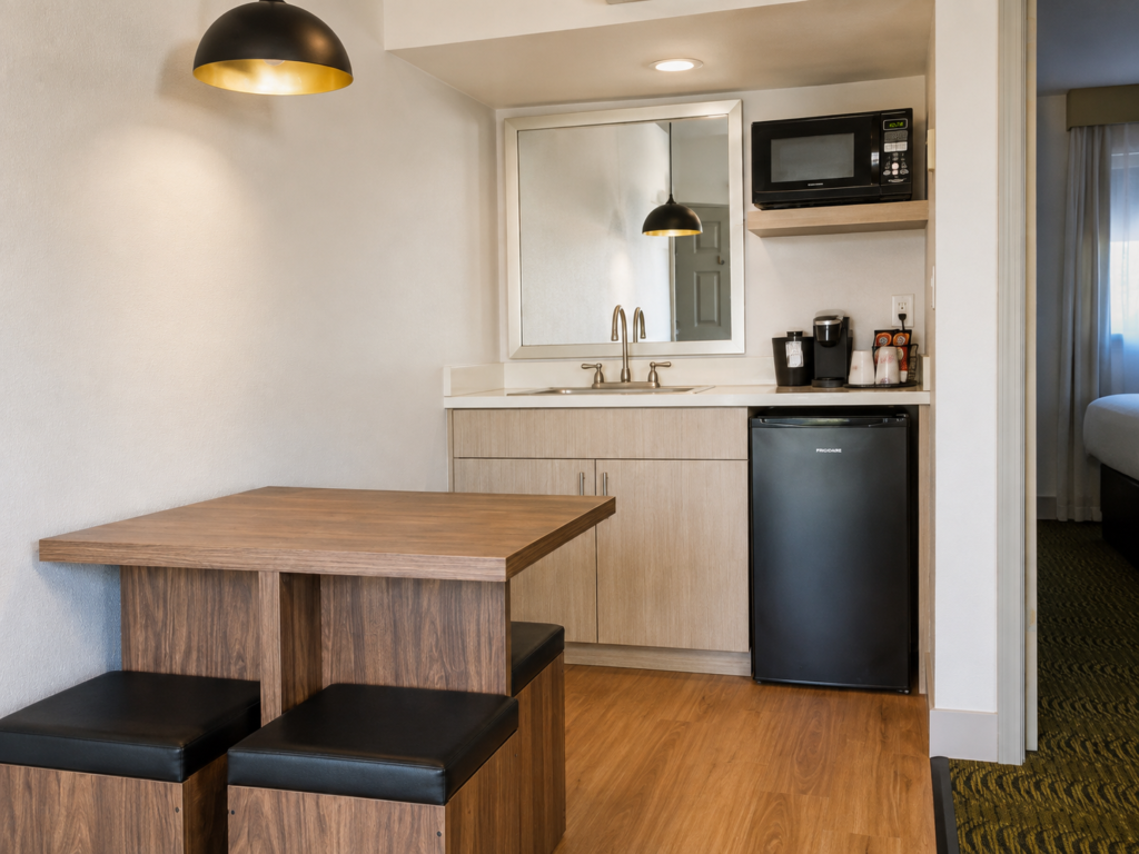 Wet bar in the Sedona View King Suite with microwave, mini-refrigerator, coffeemaker and two-seat dining table