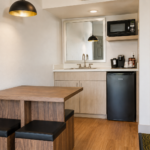 Wet bar in the Sedona View King Suite with microwave, mini-refrigerator, coffeemaker and two-seat dining table