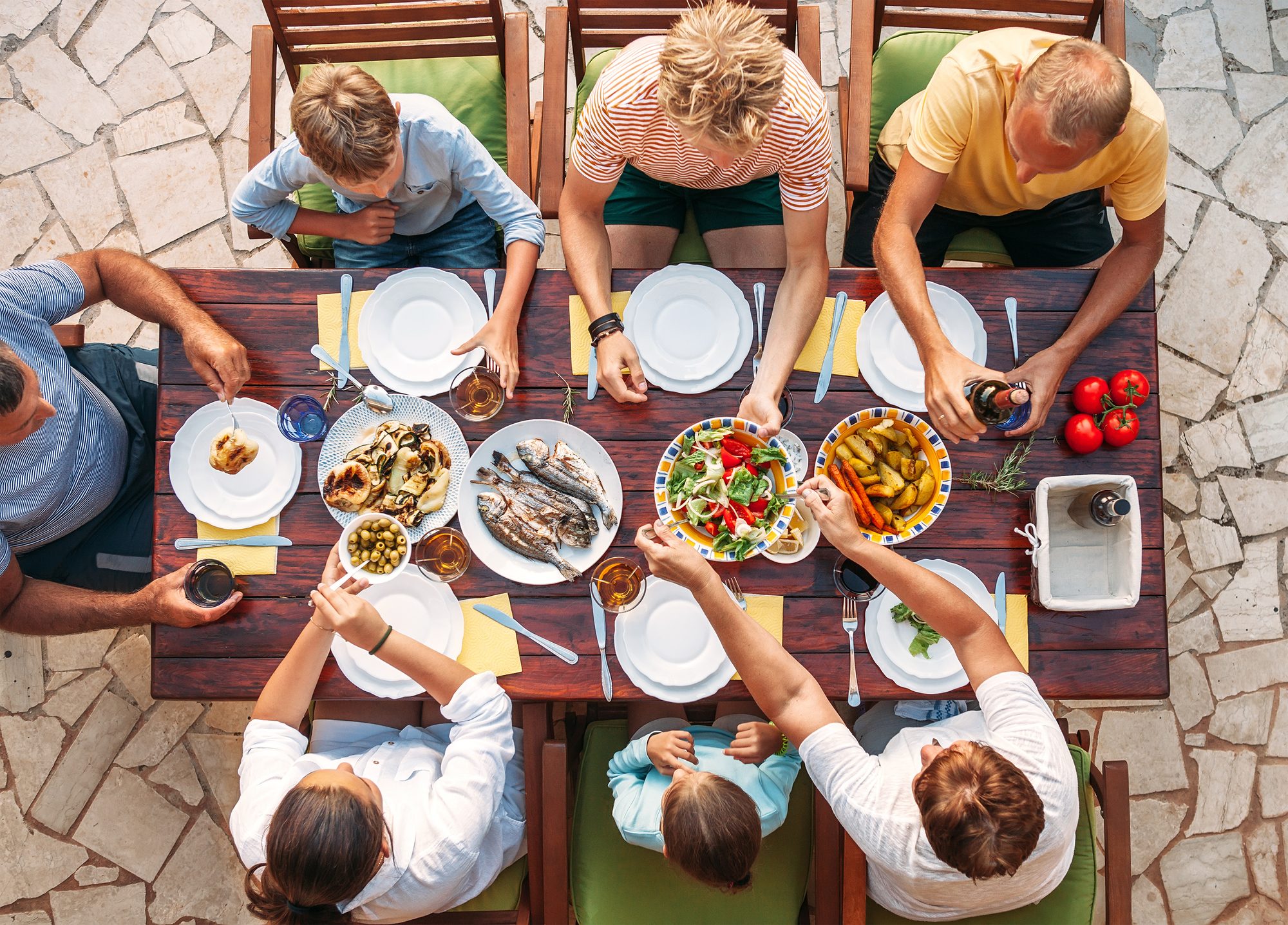 Large group seated together at a long table for dinner in Sedona