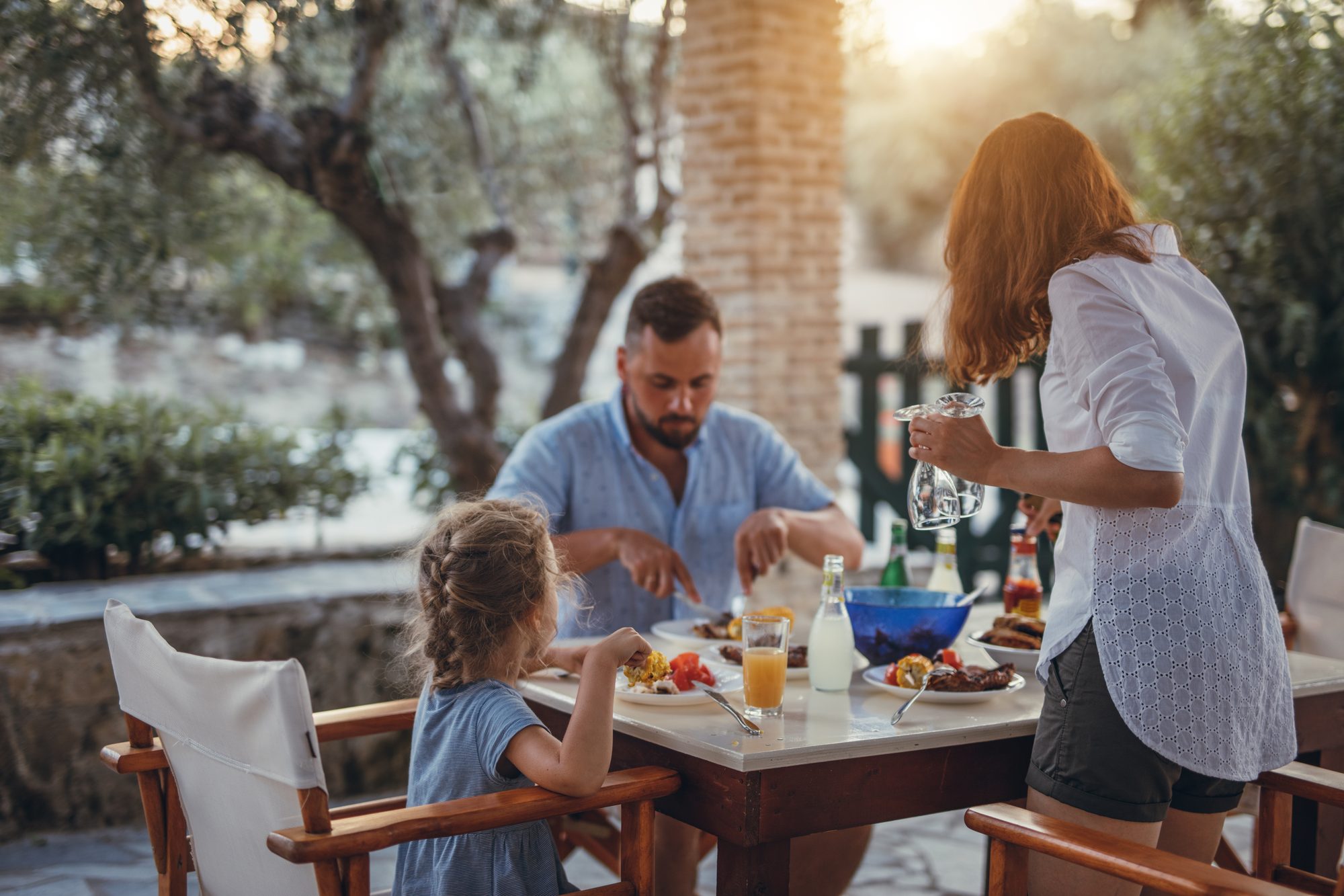 Family enjoying a casual outdoor restaurant patio dinner in Sedona